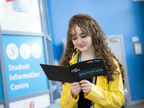 A levels student looking through a book