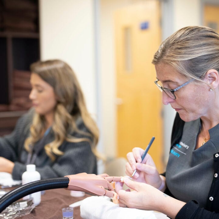 A beauty student practicing nails