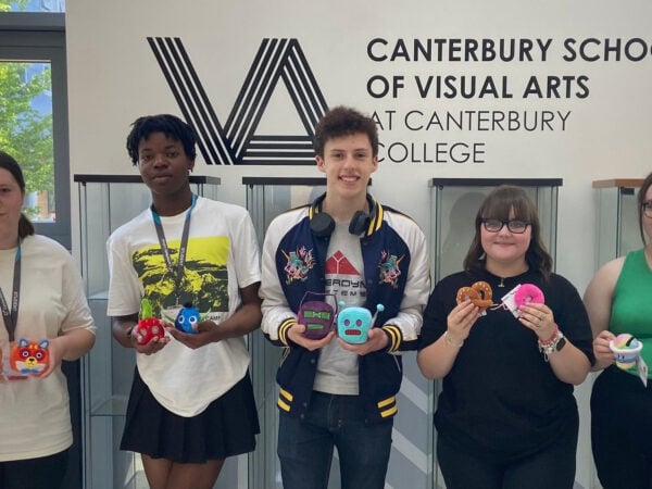 students taking part in a Keel toy, showing off what they have made