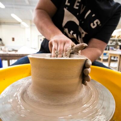 Sculpting student working on a piece