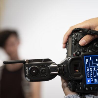 A camera with a student out of focus