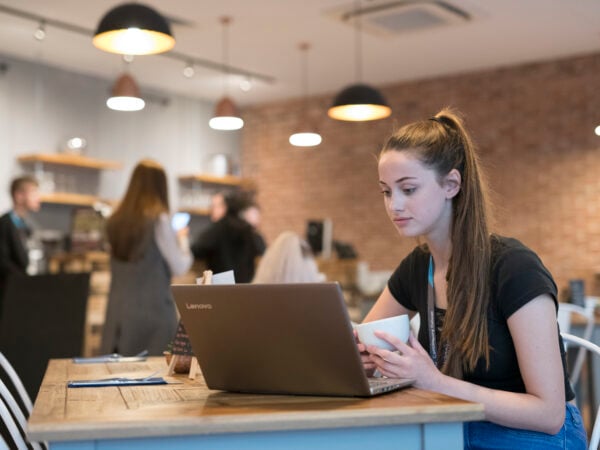 Student sitting in the refectory