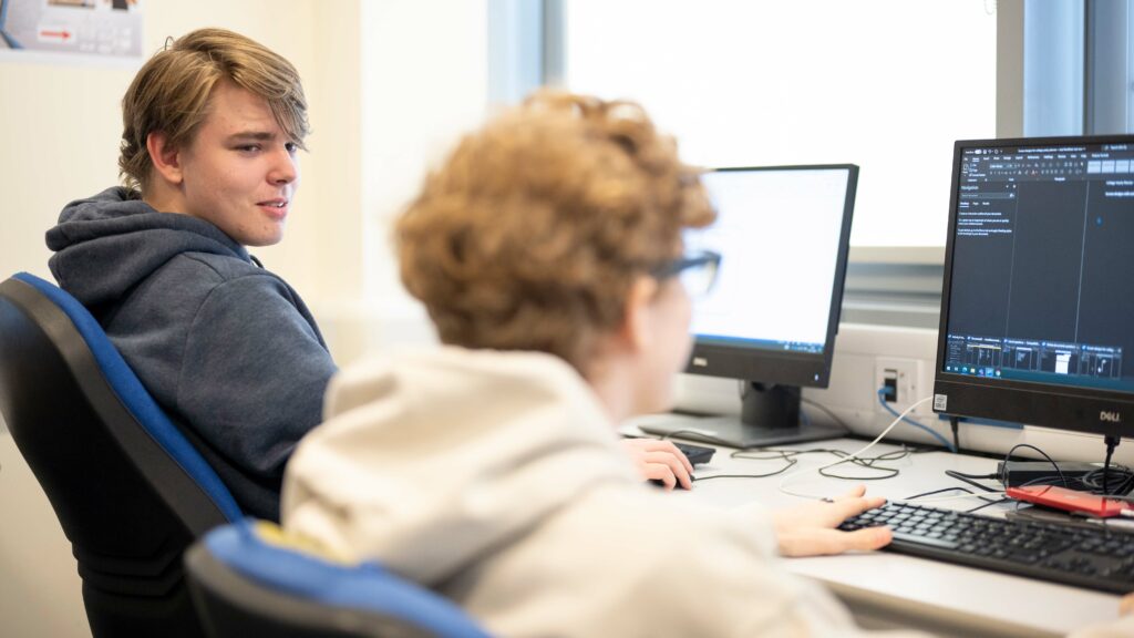 Computing Students Sat at Computers