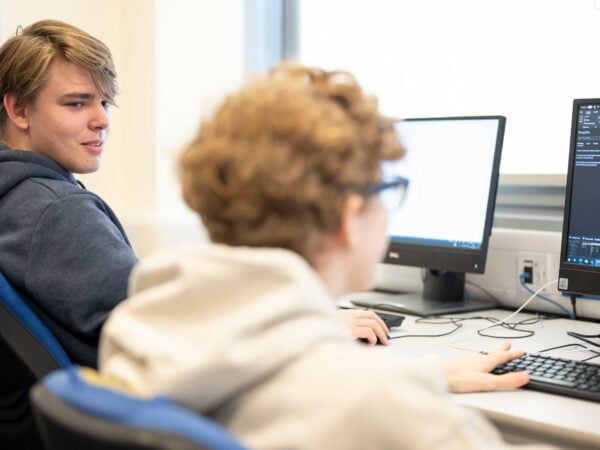 Computing Students Sat at Computers