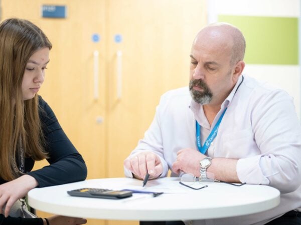 Lecturer working with a student