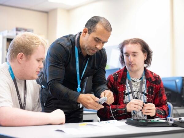 Computing Students Working with Lecturer