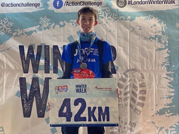 Scott Jacobs holding up completion sign after his London Winter Walk