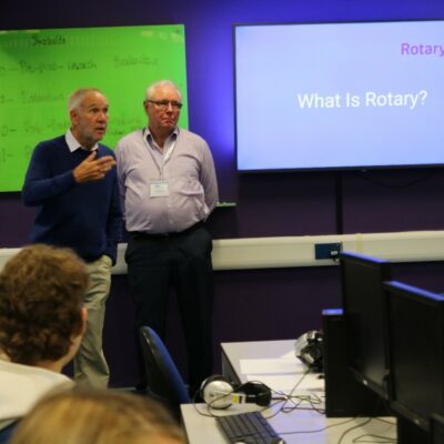 Rotary Radio UK Presenters speaking to students about a podcast project.