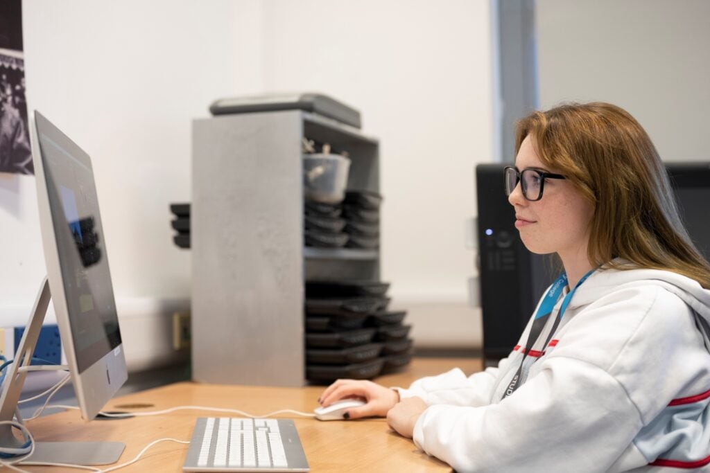 students looks at a computer