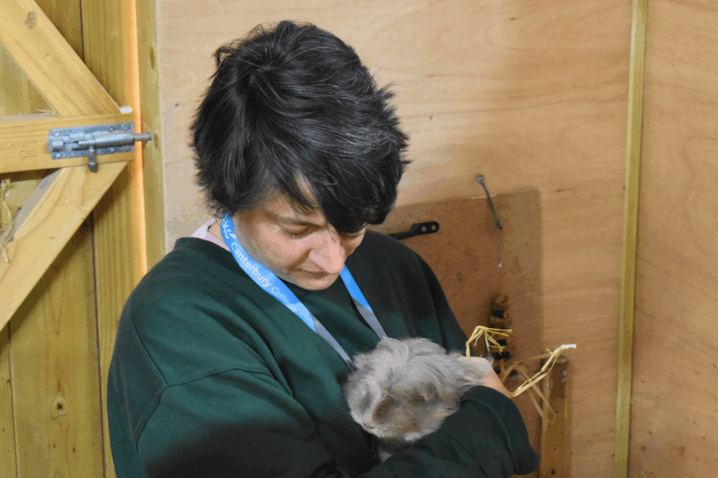 access to he student holds an animal