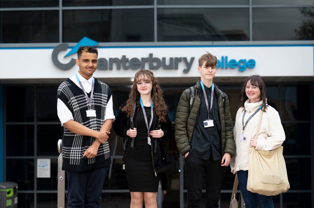 4 students standing outside a College