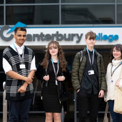 4 students standing outside a College