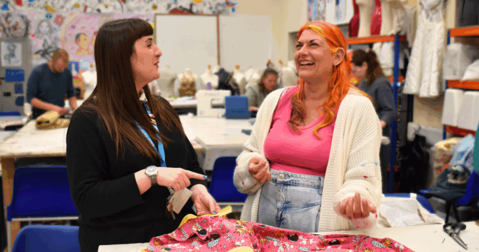 two adult learners in a sewing for beginners lesson