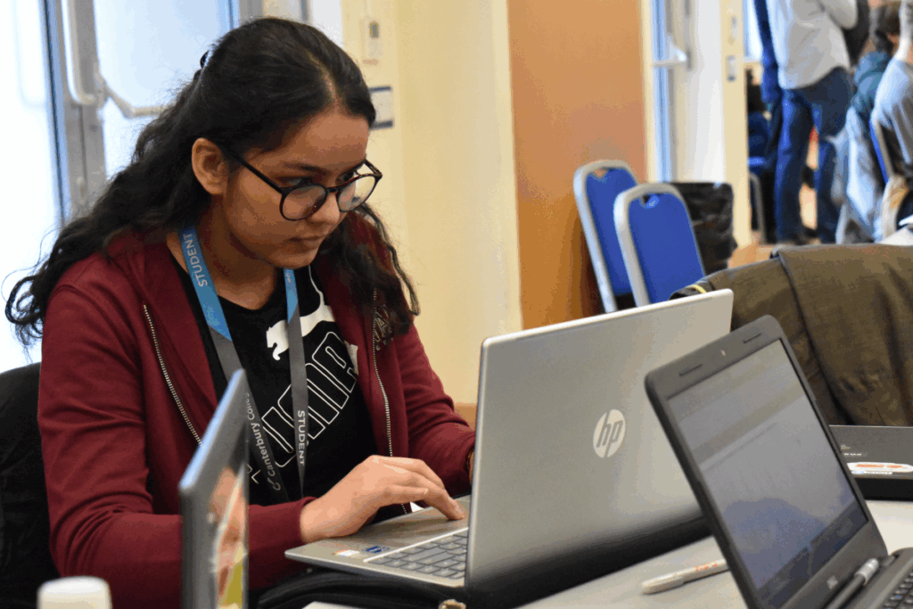 female student studies at a laptop