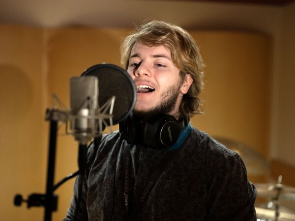 Student singing into a microphone