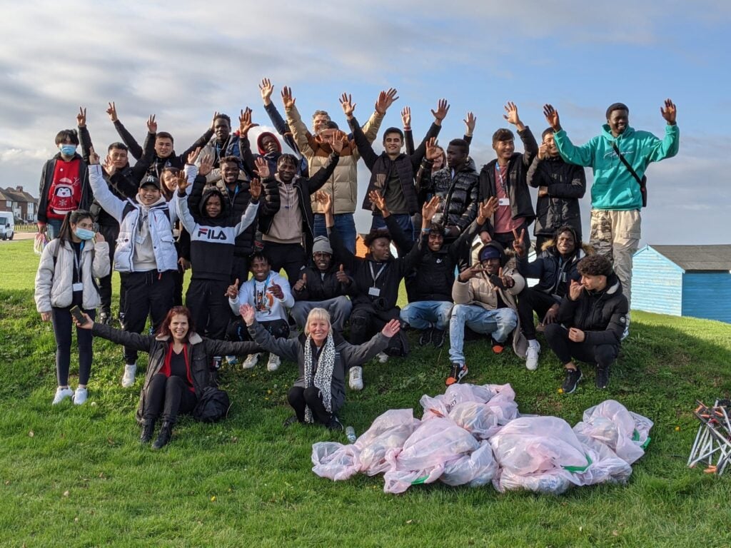 students pose for a photo after cleaning at Hambrook Marshes