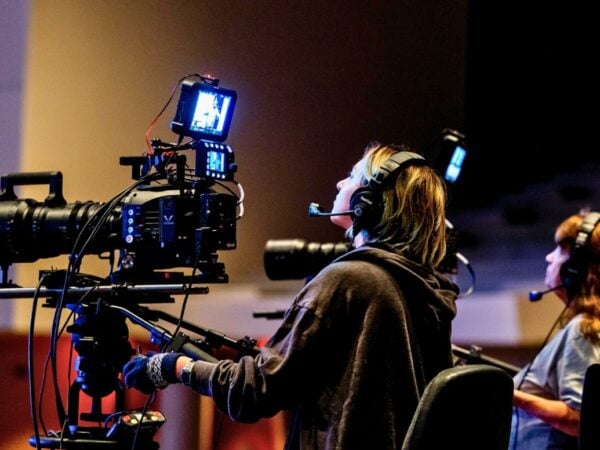 A person operating a video camera