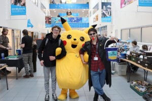 students pose with Pikachu at bitcrush event