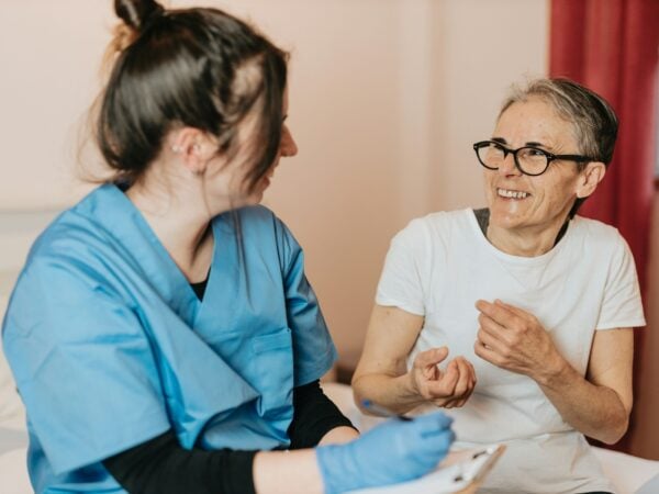 Health care worker with patient