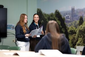 Students presenting in a boardroom