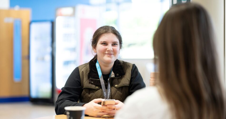 student speaking to staff at EKC Canterbury College