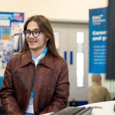 EKC Canterbury College student speaking to staff