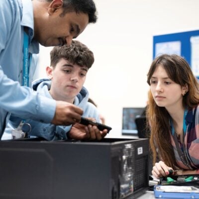 computing students with lecturer at EKC Canterbury College