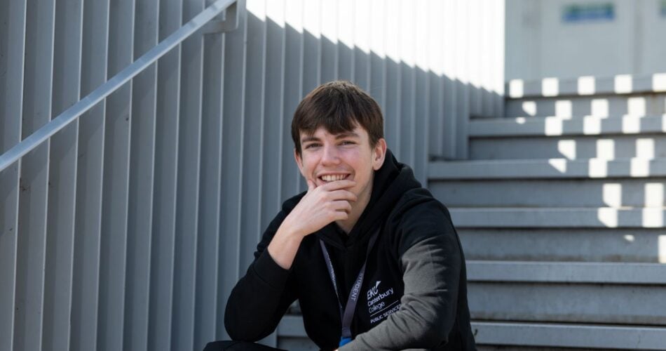 EKC Canterbury College student sitting on steps