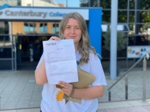 female student receives results for her T Level course at EKC Canterbury College