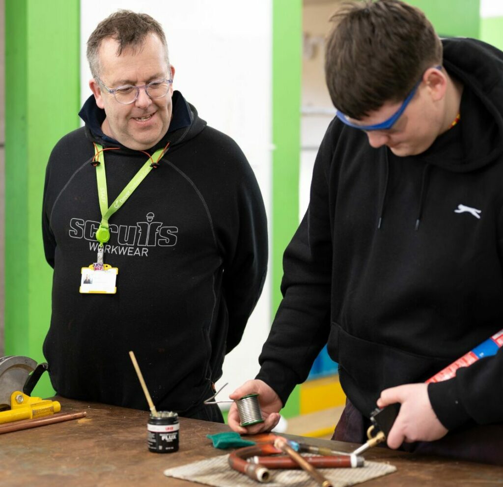 plumbing workshop, student and lecturer