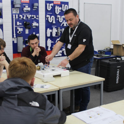 Students watching a demonstration from a representative from Honeywell