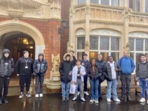 students stand in front of a building at Bletchley park