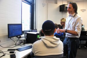 students interact with a guest speaker