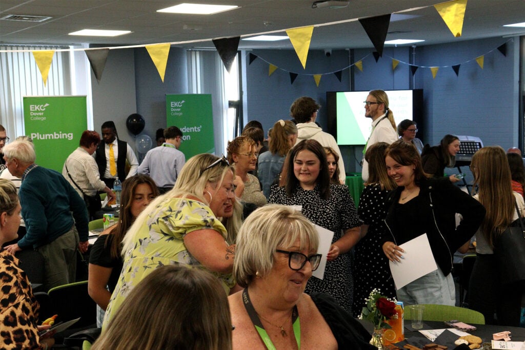 Busy room with bunting and people chatting