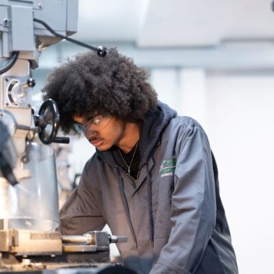 Student using machine in Engineering workshop