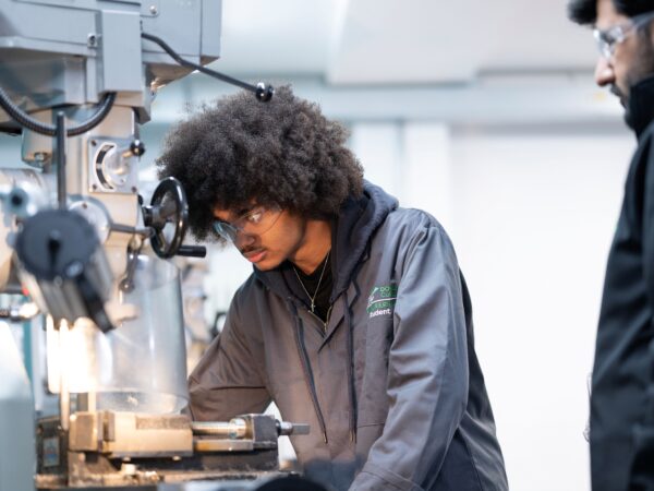 Student using machine in Engineering workshop