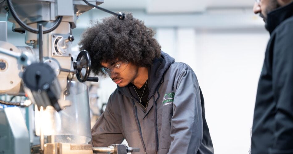 Student using machine in Engineering workshop