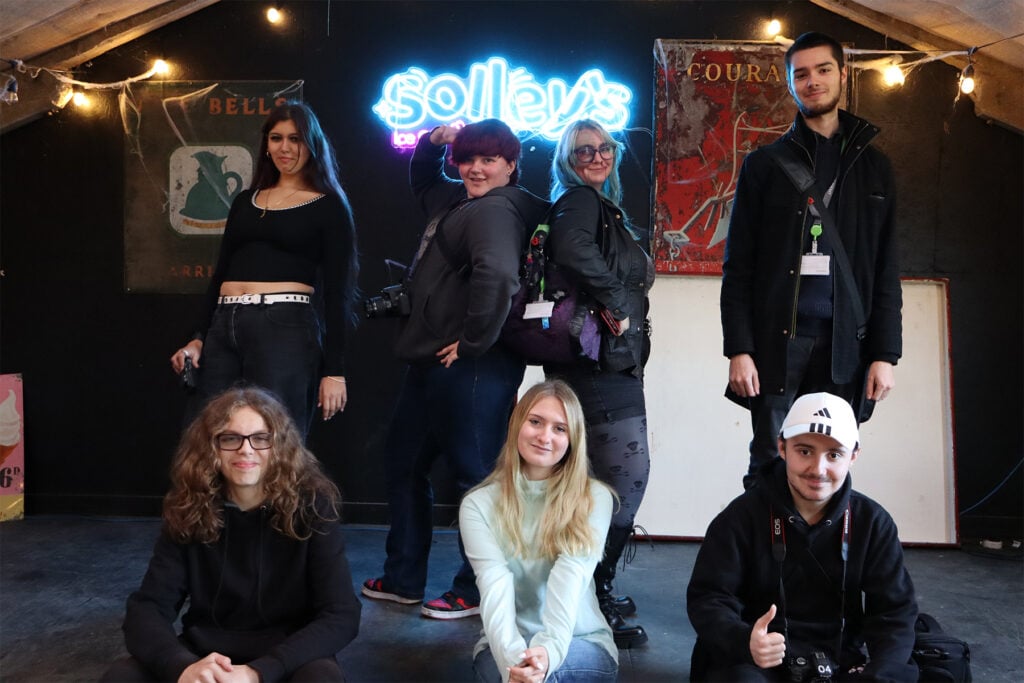 a group of art and design students take a group photo at Solley's ice cream