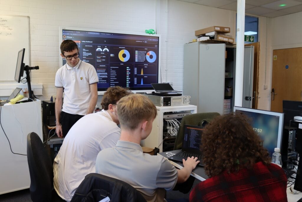 students work together during a computing workshop