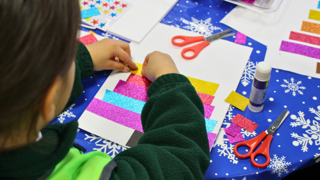 a local child creates a craft