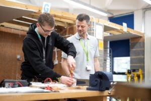 Student and tutor working in workshop
