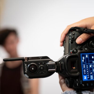 A camera with a student out of focus