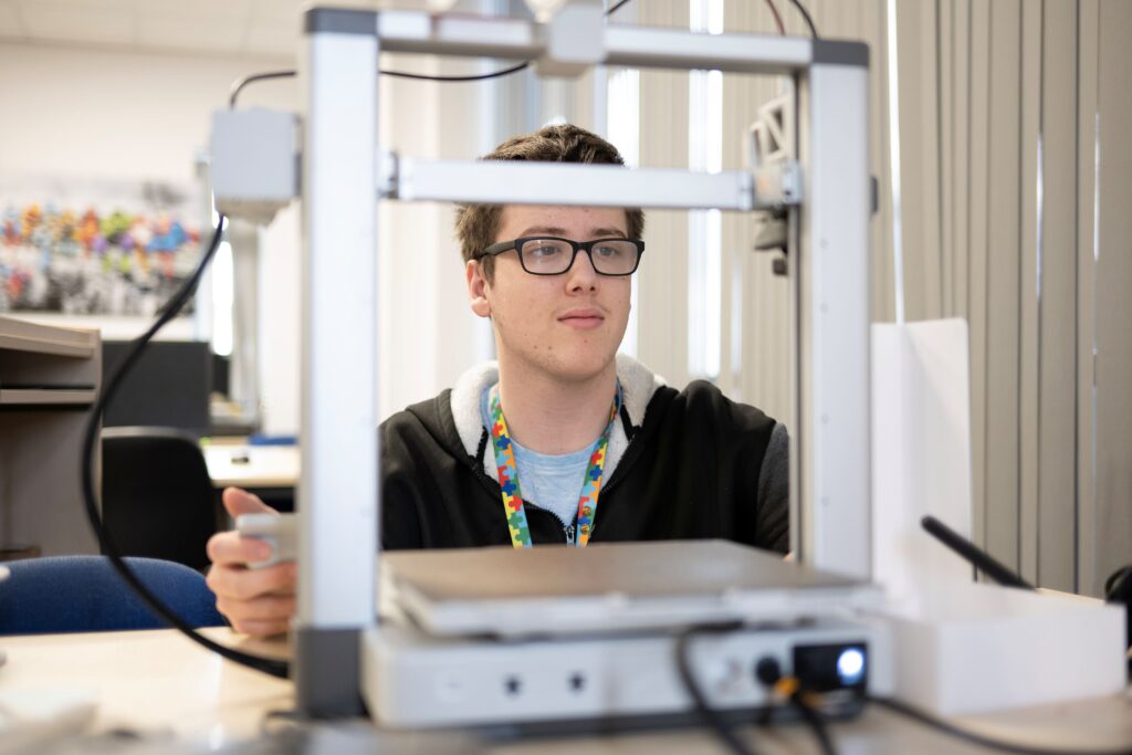 a student uses a 3d printer