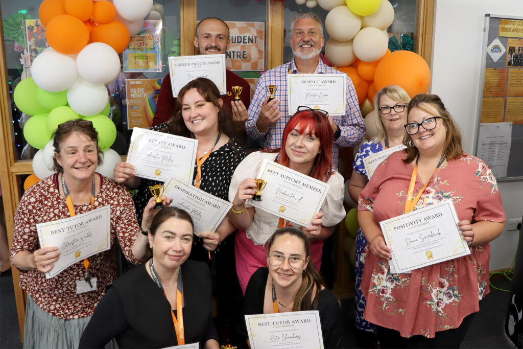 Group of people holding certificates