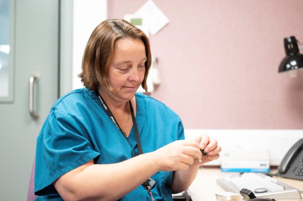 Nurse sat at a desk