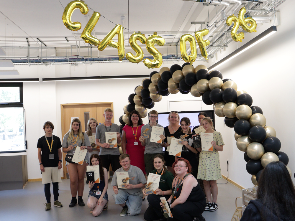 group shot of learners holding trophys