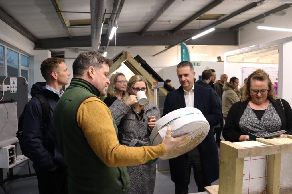 Business man explaining his product to a group of people