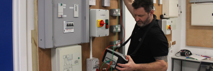 Student checking plumbing work