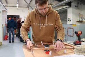 plumbing student working on copper pipe