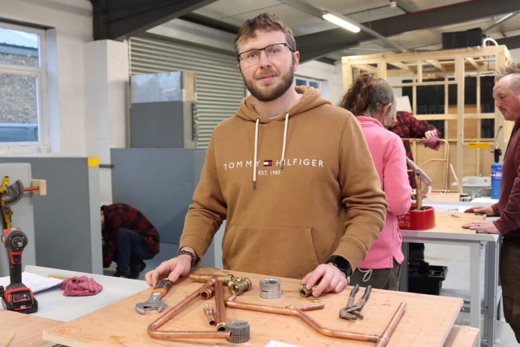 plumbing student in the workshop